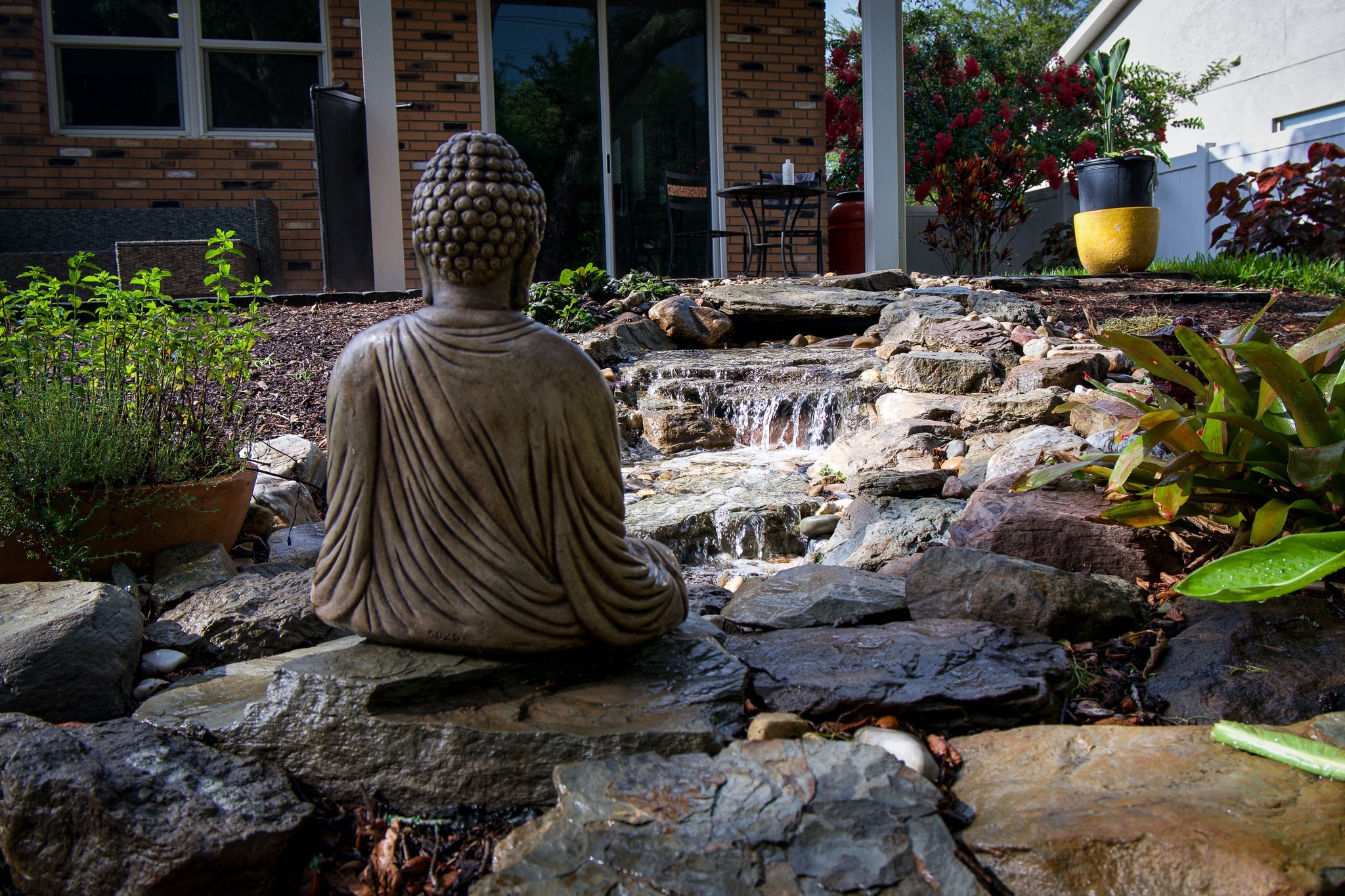 statue with water fountain landscaping feature